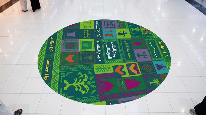 Anti-slip floor sticker with directional arrow in a retail store — Admark, Saudi Arabia Custom printed promotional floor grap