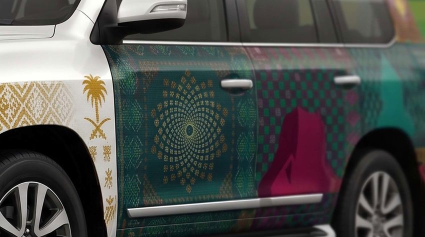 Saudi National Day 96 vehicle wrap with flag and emblem on a car in Riyadh — Admark Prints National Day fleet vehicle wrap in