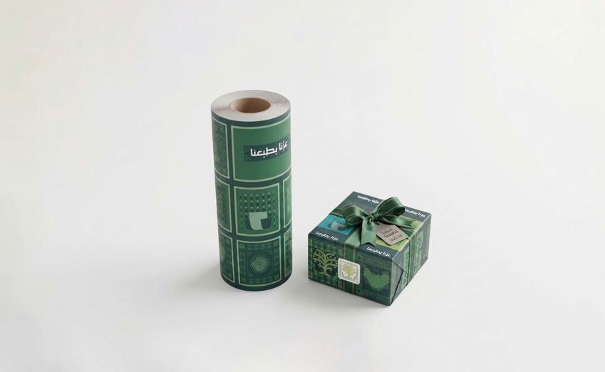 Custom printed wrapping paper with repeating brand logo for corporate gifts — Admark, Saudi Arabia Branded gift wrap in compa